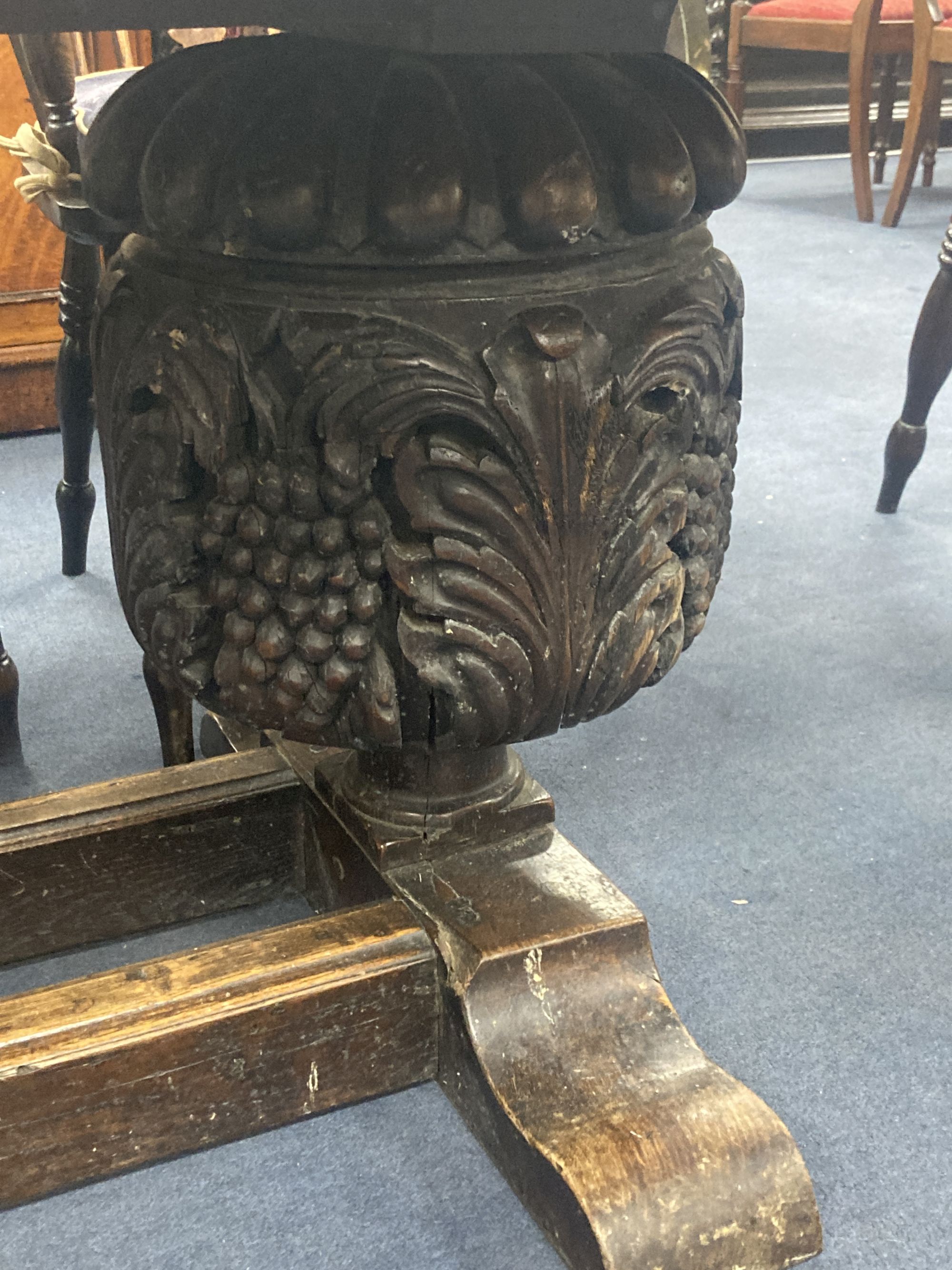 An oak refectory table, the top (formerly a door), length 209cm, depth 85cm, height 73cm